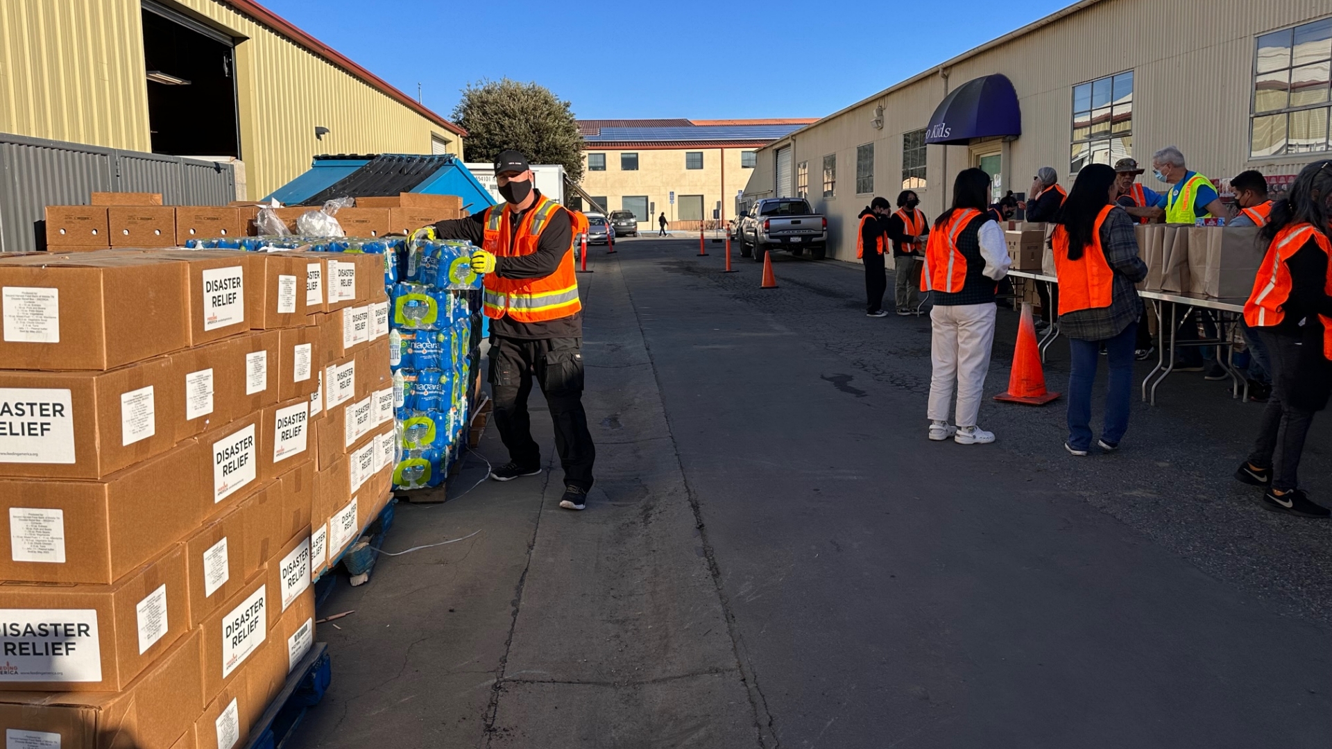 Volunteers help with drive-thru food distribtion at Community Food bank of San Benito County in Hollister, California.